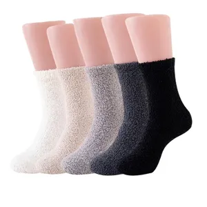 Soft coral fleece socks set in five neutral colors displayed on foot mannequins.