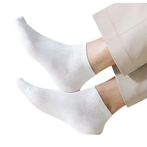 Comfortable white cotton socks for men featuring a ribbed texture and secure fit