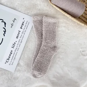 Macro view showing the soft coral fleece texture of these mauve plush fuzzy sleep socks