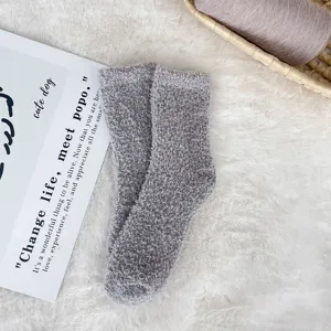 Detailed macro shot showing the soft texture of gray coral fleece cozy sleep socks