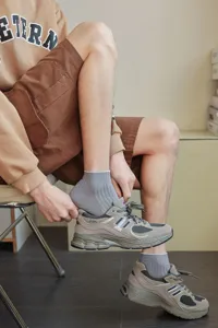 Close-up of men's grey low-cut socks with ribbed cuffs for daily wear and comfort