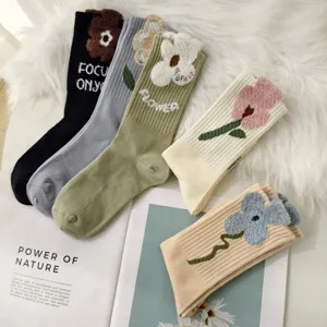 Vintage floral jacquard mid-calf socks for women in multiple colors on a cozy background
