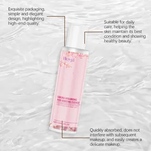 Close-up detail view of the pink hyaluronic acid essence bottle, highlighting elegant design.