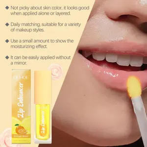 Huile repulpante et hydratante pour les lèvres OUHOE au goût d'orange, soin nourrissant quotidien.