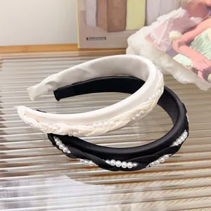Elegante gevlochten parel hoofdband voor dames in zwart en crème