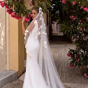 Detailed view of 3-meter cathedral wedding veil with floral appliques and pearls