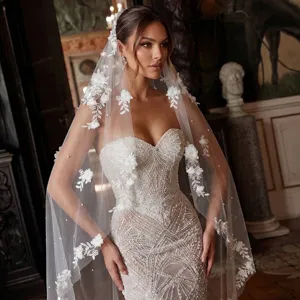 Detail of a 3-meter cathedral wedding veil with elegant 3D floral appliqués and beads.