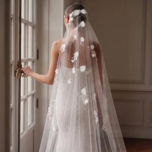 Detail of 3-meter long bridal veil with delicate 3D flower and pearl embroidery