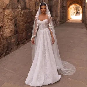 Detailed view of long bridal veil with delicate floral appliqués and 3-meter cathedral train