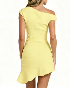 Back view of a yellow one-shoulder dress with ruched details and a ruffle hem.