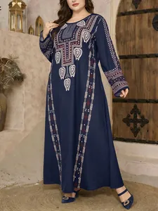Detailed view of a navy blue plus size maxi dress with vintage ethnic patterns.