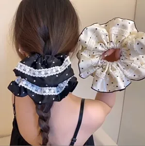 Oversized polka dot scrunchies with delicate lace trim for stylish hairstyles
