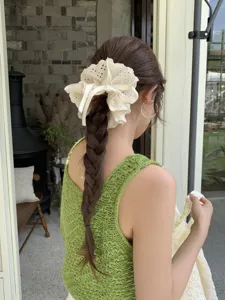 Elegant large 4-layer lace scrunchie with adjustable drawstring shown on braided hair