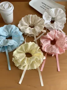 Set of five layered lace scrunchies with adjustable drawstrings in pastel colors