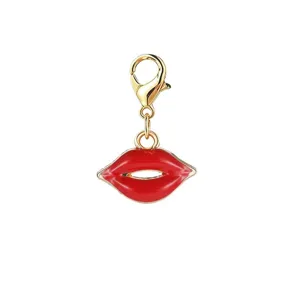 Detailed view of a red enamel lip charm with a golden lobster clasp