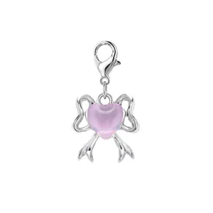 Detailed view of silver bow charm with pink translucent heart and lobster clasp