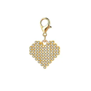 Macro view of gold heart charm pendant with micro-paved zircons and lobster clasp