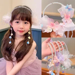 Detail view of sweet floral and pearl headbands for girls in forest style theme