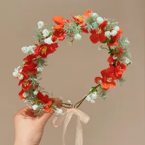 Ghirlanda di fiori arancioni con nastro per bambine stile fata
