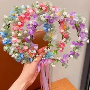 Ghirlanda di fiori fatati con nastri per bambine in stile principessa del bosco.