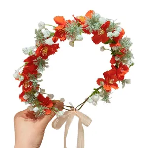 Corona di fiori arancioni con nastri per bambine in stile foresta incantata