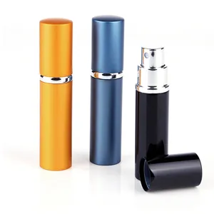 Portable refillable perfume spray bottle set with metal outer shell, travel cosmetic container.
