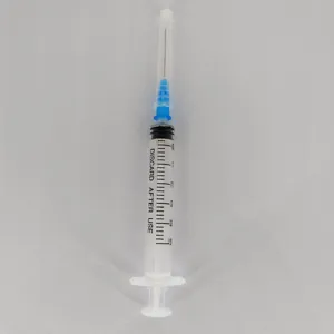 Transparent plastic perfume dispenser syringe tool with needle and clear measurement scale.