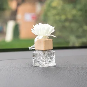 Car diffuser bottle glass aromatherapy bottle with wooden cap and white flower decor