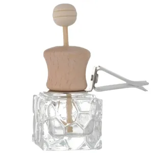 Car air vent perfume diffuser bottle empty glass container with wooden cap and clip.