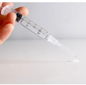 Transparent 2ml plastic perfume dispenser syringe tool with fine extension tip for travel.