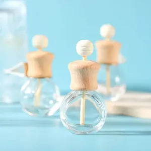 Car diffuser glass bottle with wooden cap and diffuser stick, ideal for vehicle air freshener.