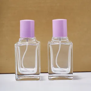 Frasco de perfume de vidrio transparente de 50ml con tapa morada envase rociador cosmético