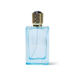 50ml empty glass perfume bottle with ornate gold cap and blue rectangular spray design
