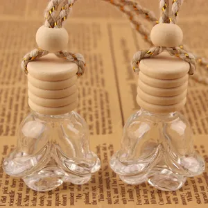 Flacon de parfum de voiture rose pendentif en verre d'huile essentielle avec bouchon en bois.