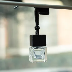 Square glass car perfume bottle pendant with black wooden cap and hanging cord for essential oil.