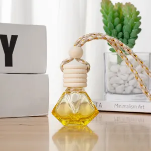 Diamond glass car perfume bottle with wooden cap and woven hanging rope for auto decor.