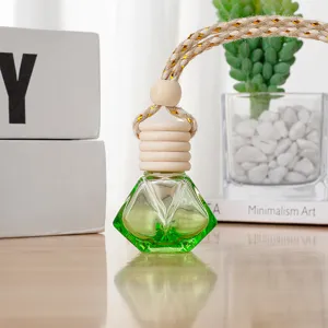 Green diamond car perfume bottle hanging ornament glass diffuser for vehicle interior decor.