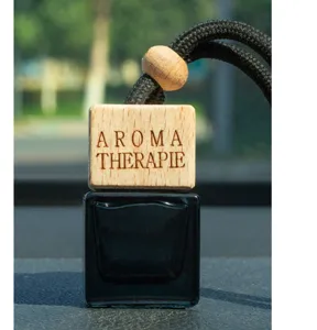 Car hanging perfume bottle with wooden diffuser cap and black glass container, 8ml size.