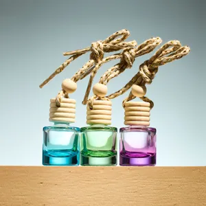 Car hanging perfume bottle set, glass diffuser bottles with wooden caps and ropes. Detail view.