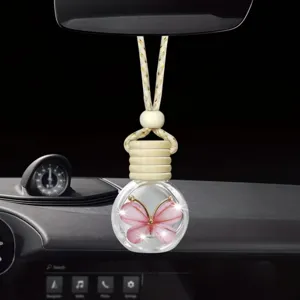 Flacone di profumo sospeso per auto con farfalla rosa, diffusore di aromaterapia in vetro.