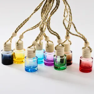 Colorful car hanging perfume glass bottle with wooden cap and woven rope for vehicle interior.