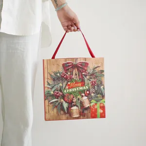 Caja de regalo del calendario de Adviento de Navidad con corona y 24 puertecitas.