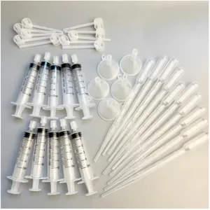 Perfume dispensing tool set, includes plastic syringes, funnels and droppers for essential oils.
