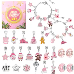 Detailed view of pink Christmas DIY bracelet kit with various festive charms and beads