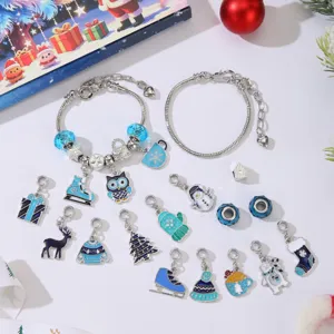 Christmas DIY jewelry kit featuring blue enamel charms and two silver-toned snake chains