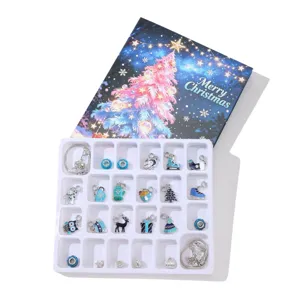 Blue Christmas advent calendar jewelry kit featuring 24 DIY charms and two bracelets