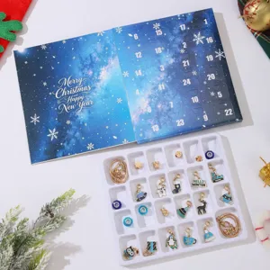 Open Christmas advent calendar jewelry box showing various festive charms and bracelets