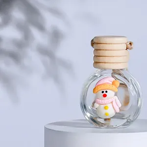 Mini glass car perfume diffuser bottle with wooden lid and cute snowman decor detail