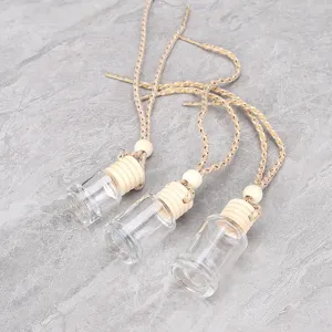 Set de flacons vides de pendentif de parfum de voiture avec bouchon en bois et corde tressée.