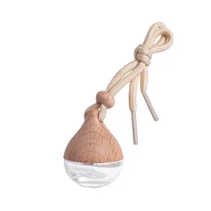 Flacon de parfum voiture goutte d verre diffuseur avec bouchon en bois et corde beige.
